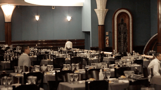 The tables inside Tango Porteño's theatre being laid for dinner